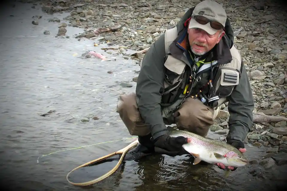 Angler with a nice Moraine Creek Rainbow &middot; Katmai National Preserve